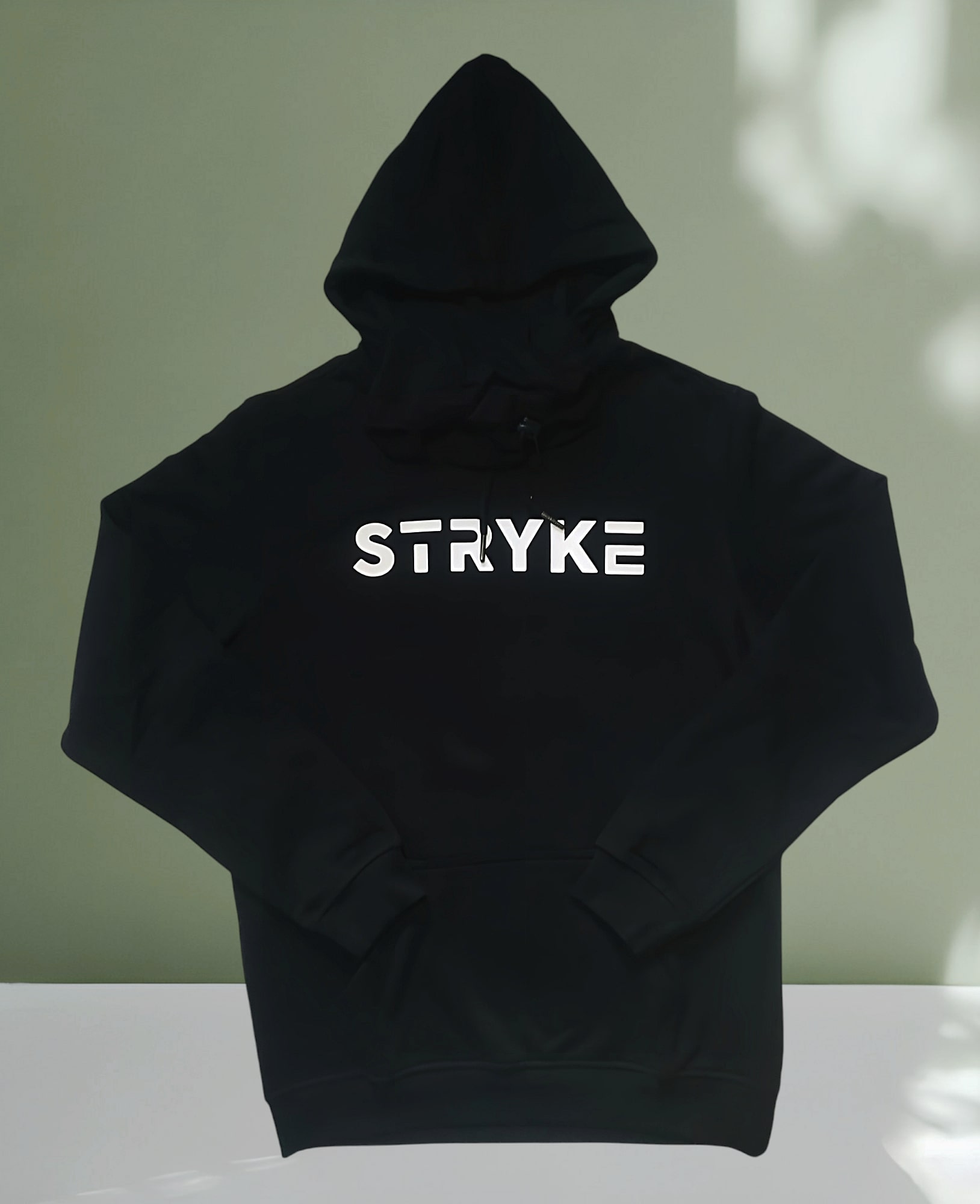 "Black Stryke Hoodie with minimalist design, featuring a sleek and comfortable fit, perfect for casual wear or outdoor activities."